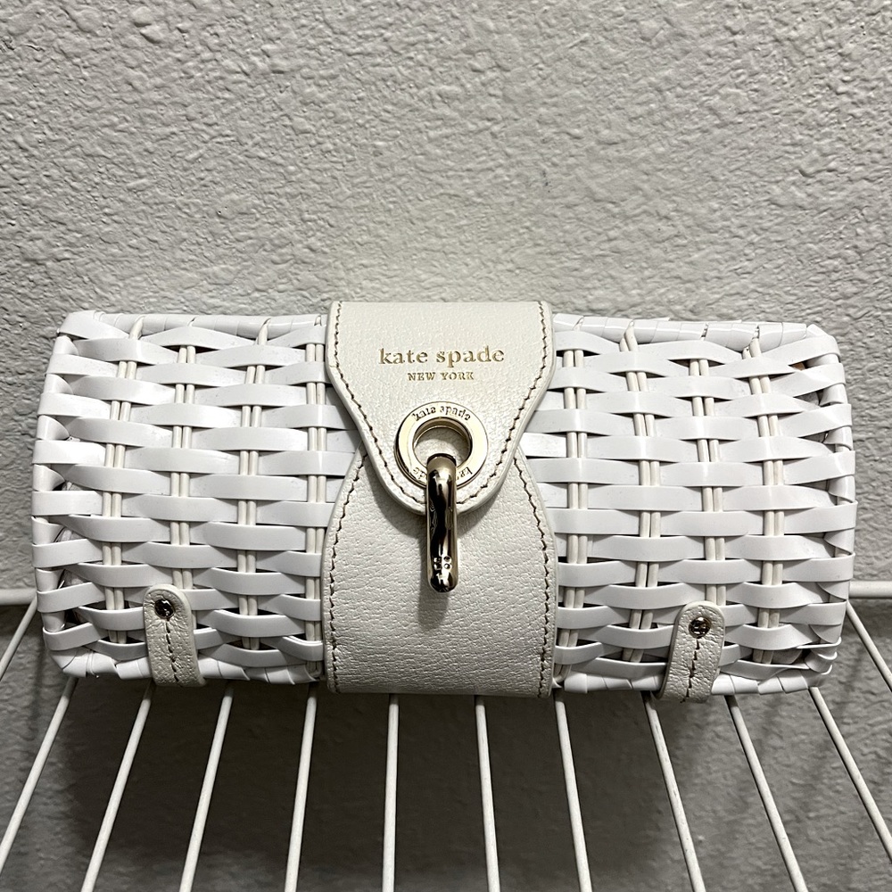 Cute Kate Spade, white woven clutch with gold accents!